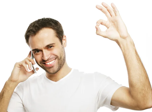 Casual young man showing thumbs up sign — Stock Photo, Image