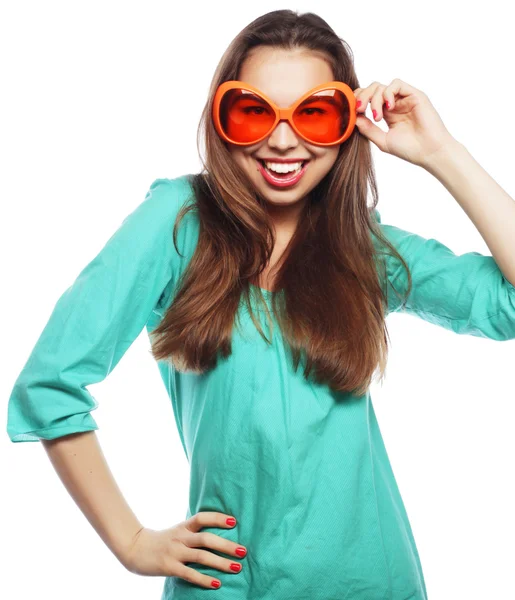 Playful young woman with party glasses. — Stock Photo, Image