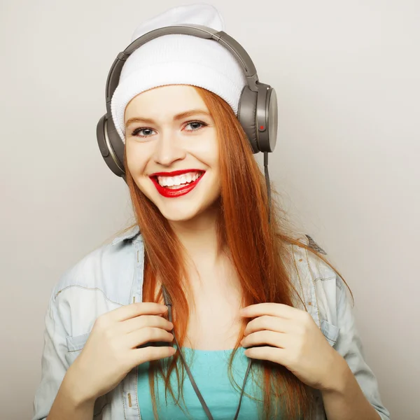 Young woman with headphones listening music — Stock Photo, Image