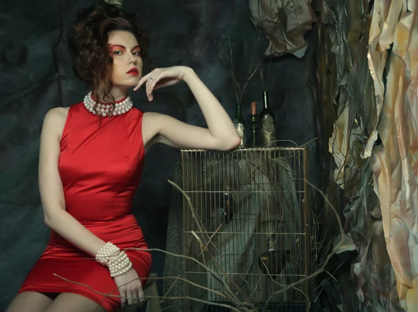 Young woman in red dress — Stock Photo, Image