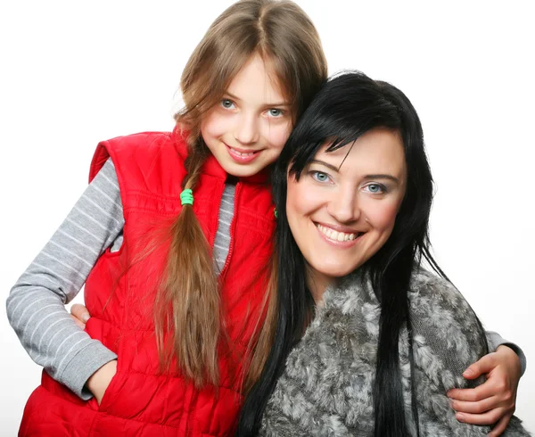 Madre y su hija sonriendo a la cámara — Foto de Stock