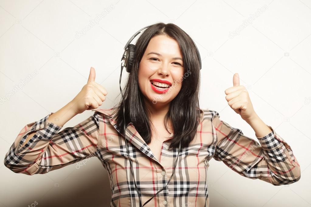 happy woman with headphones listening music