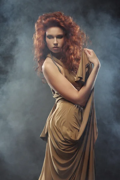 Woman with bright red curly hair — Stock Photo, Image