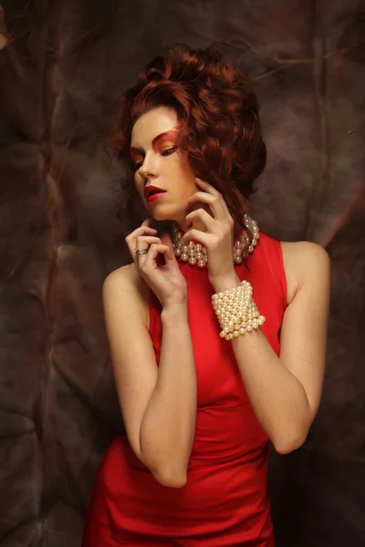 Young woman in red dress — Stock Photo, Image