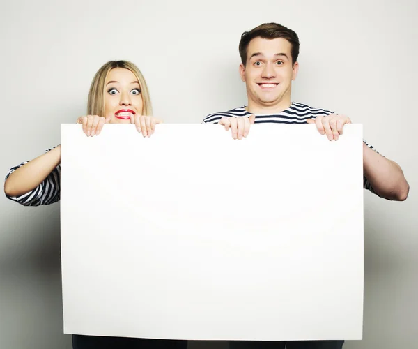 Couple holding a banner — Stock Photo, Image