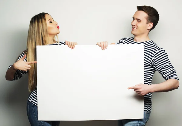 Couple holding a banner — Stock Photo, Image