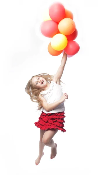 Chica salto con globos — Foto de Stock