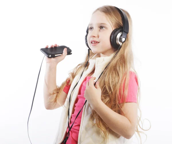 Cute happy little girl with headphones — Stock Photo, Image