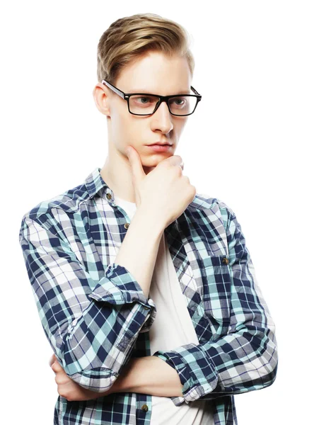 Portrait of the young thinking man with hand near face — Stock Photo, Image