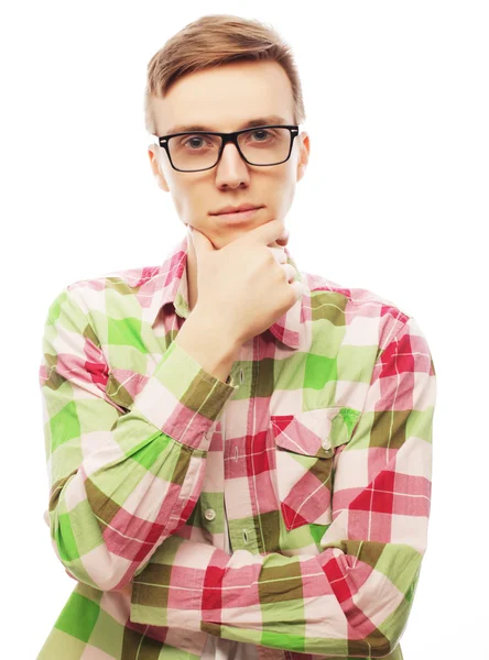 Portrait of the young thinking man with hand near face — Stock Photo, Image