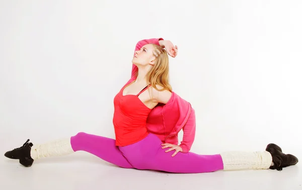 Girl  siting on gym split on white background — Stock Photo, Image