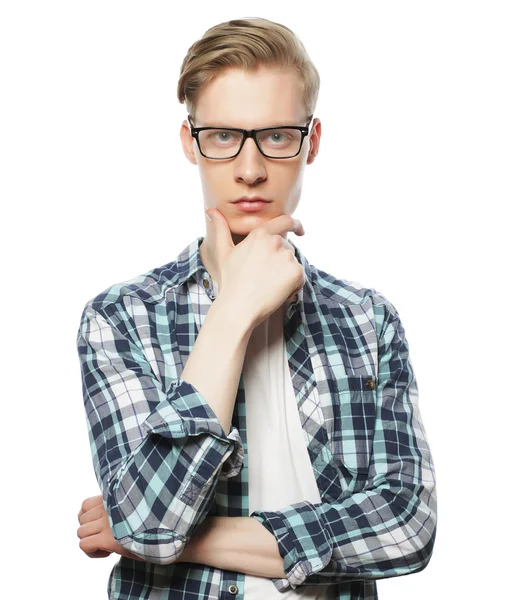 Portrait of the young thinking man with hand near face — Stock Photo, Image