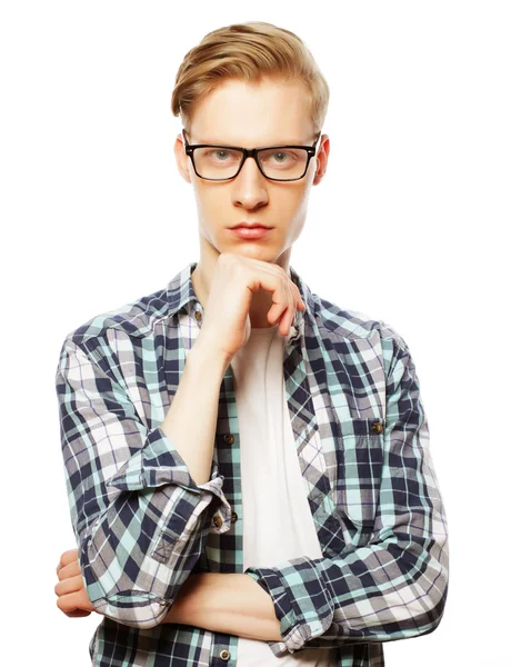 Portrait of the young thinking man with hand near face — Stock Photo, Image