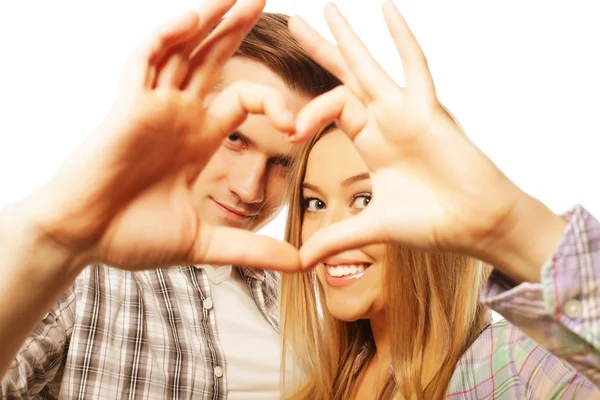 Happy couple in love showing heart with their fingers — Stock Photo, Image