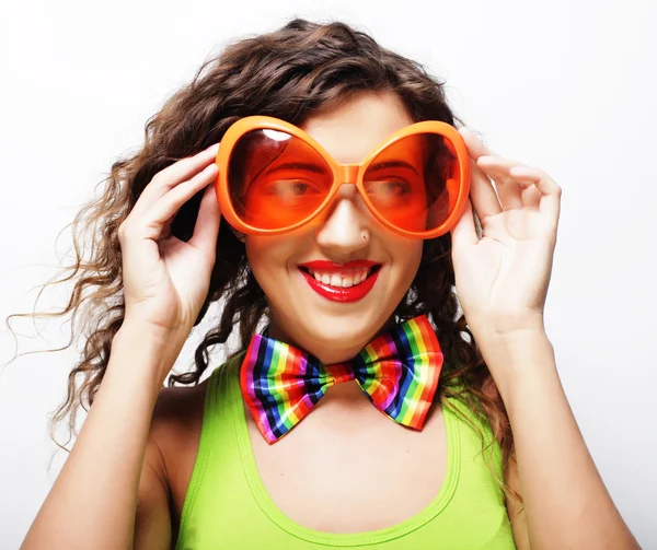 Playful young woman with party glasses. — Stock Photo, Image