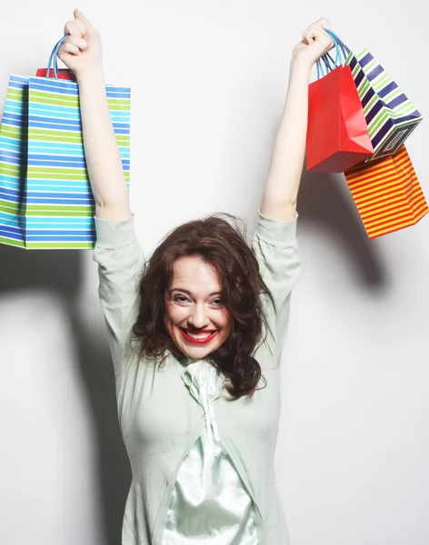 Žena s barevnými nákupní tašky — Stock fotografie