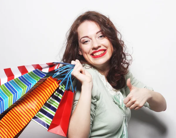 Woman with colored shopping bags — Stock Photo, Image