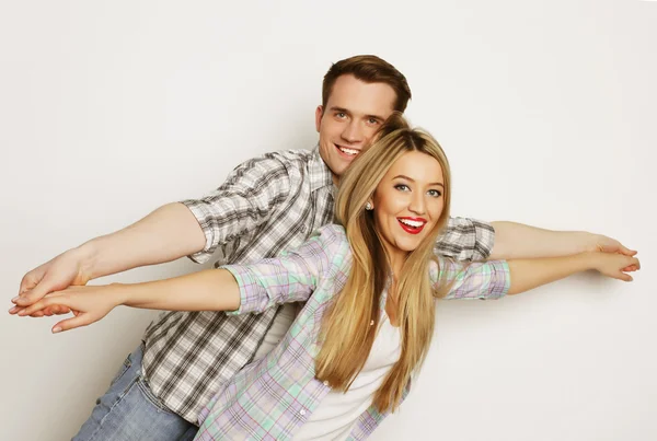 Happy young loving couple holding hands — Stock Photo, Image