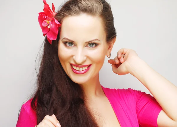 Brunette with long hair in pink wear happy smiling — Stock Photo, Image