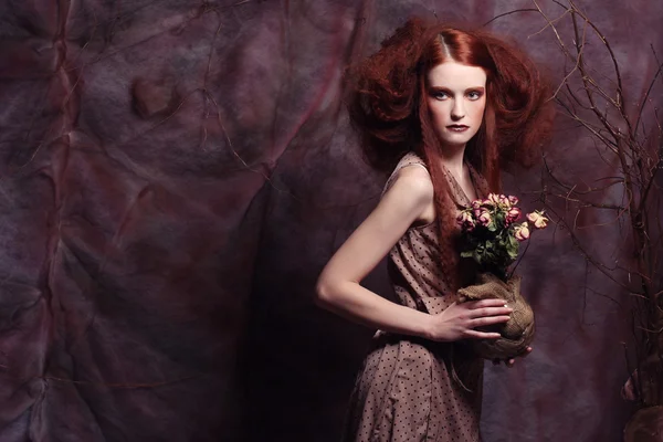 Beautiful girl with dry roses — Stock Photo, Image