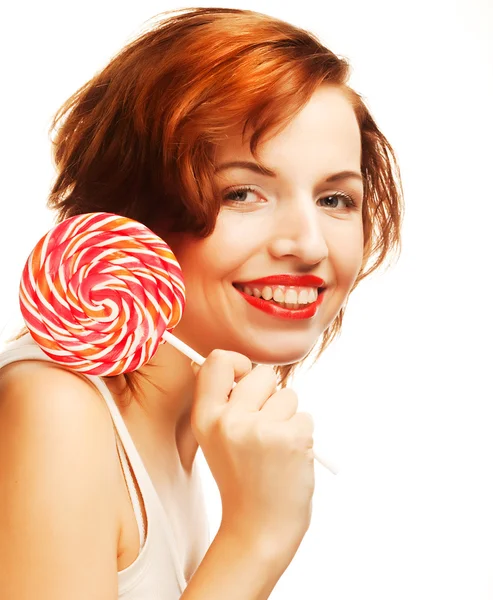 Pretty young woman holding lolly pop. — Stock Photo, Image