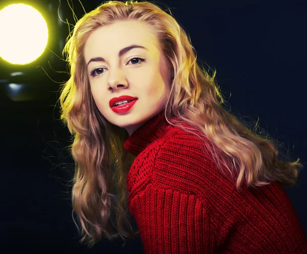 Smiling blonde in red sweater — Stock Photo, Image