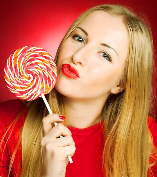 Woman holding lollypop Royalty Free Stock Photos