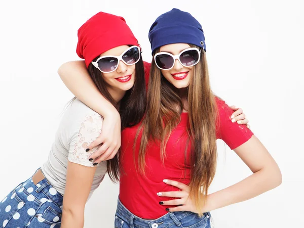 Two young girl friends standing together and having fun. — Stock Photo, Image