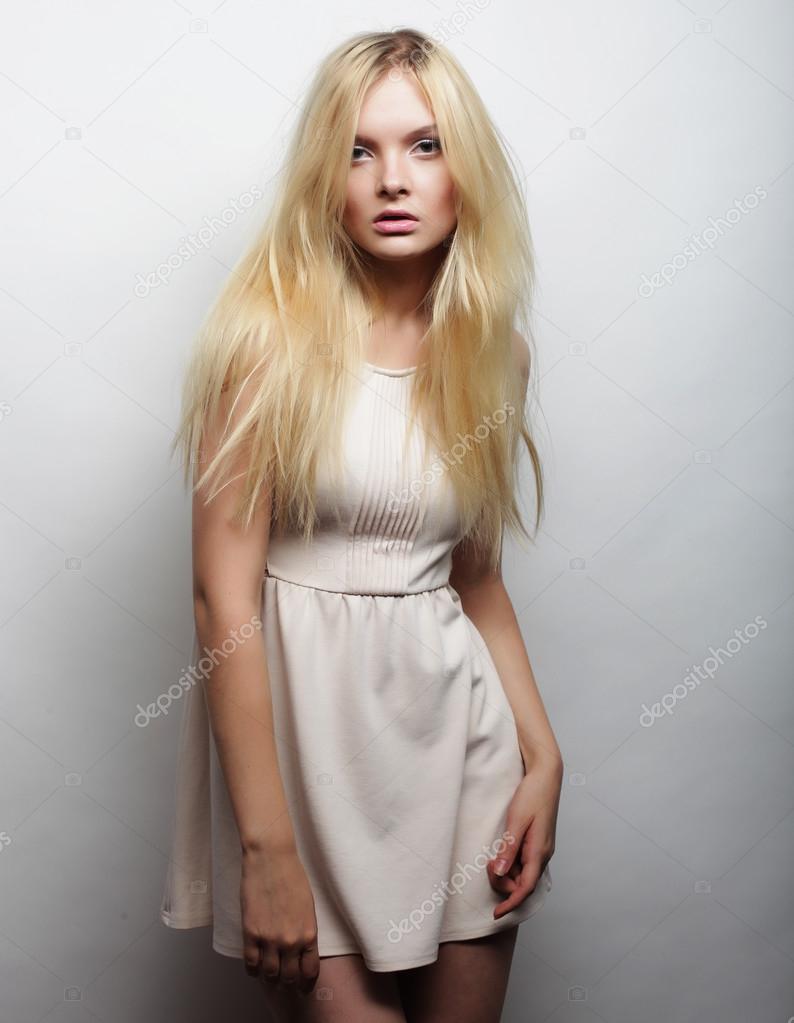 young magnificent woman in white dress.
