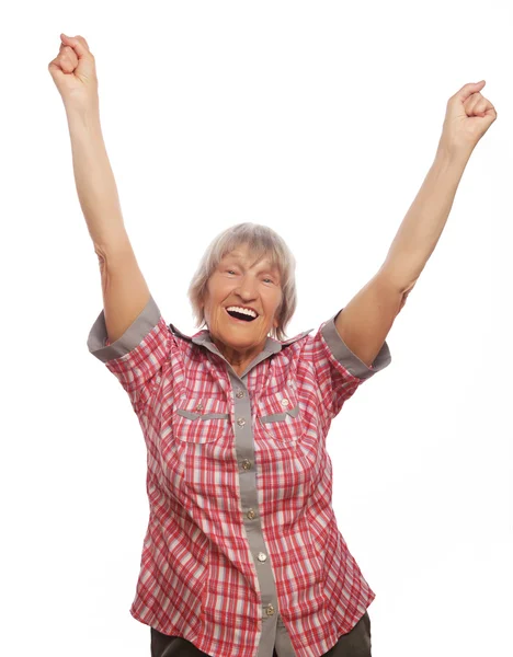 Cheerful senior woman gesturing victory over a white background — Stock Photo, Image