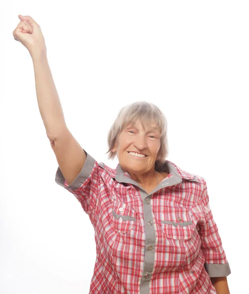Vrolijke senior vrouw gebaren overwinning op een witte achtergrond — Stockfoto