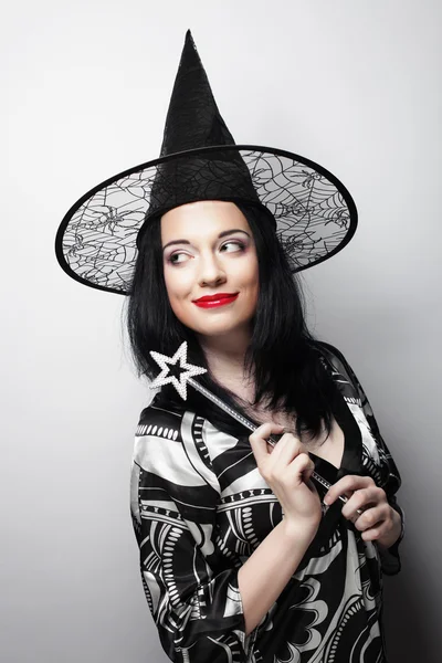 Funny Witch. Young happy woman with canival hat. — Stock Photo, Image