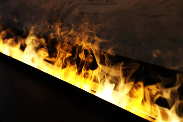 Artificial fire in the fireplace — Stock Photo, Image