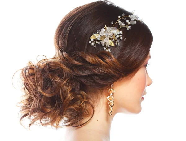 Wedding luxury hairstyle with a diadem. Back view. Young bride posing on a white background. Stock Image