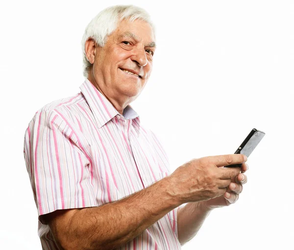 Portrait of senior man who is messaging on smartphone. — Stock Photo, Image