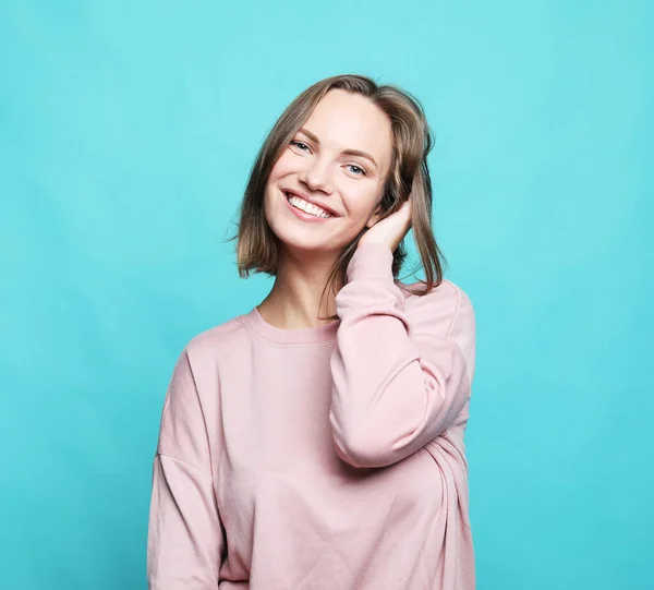 Young Cute Smiling Blond Female Wear Pink Sweater Blue Background — Stock Photo, Image