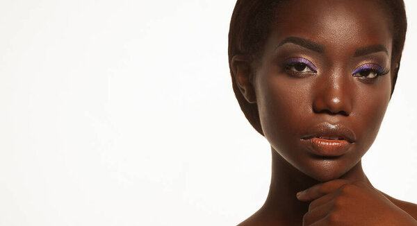 Portrait of african american woman glamour makeup over white background, close up