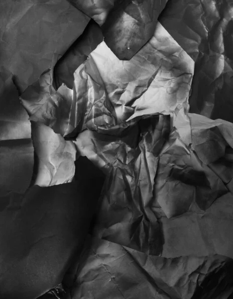 Background of fragments of crumpled paper, black and white — Stock Photo, Image