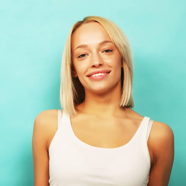 Beautiful woman wearing casual clothes, posing on blue background — Stock Photo, Image