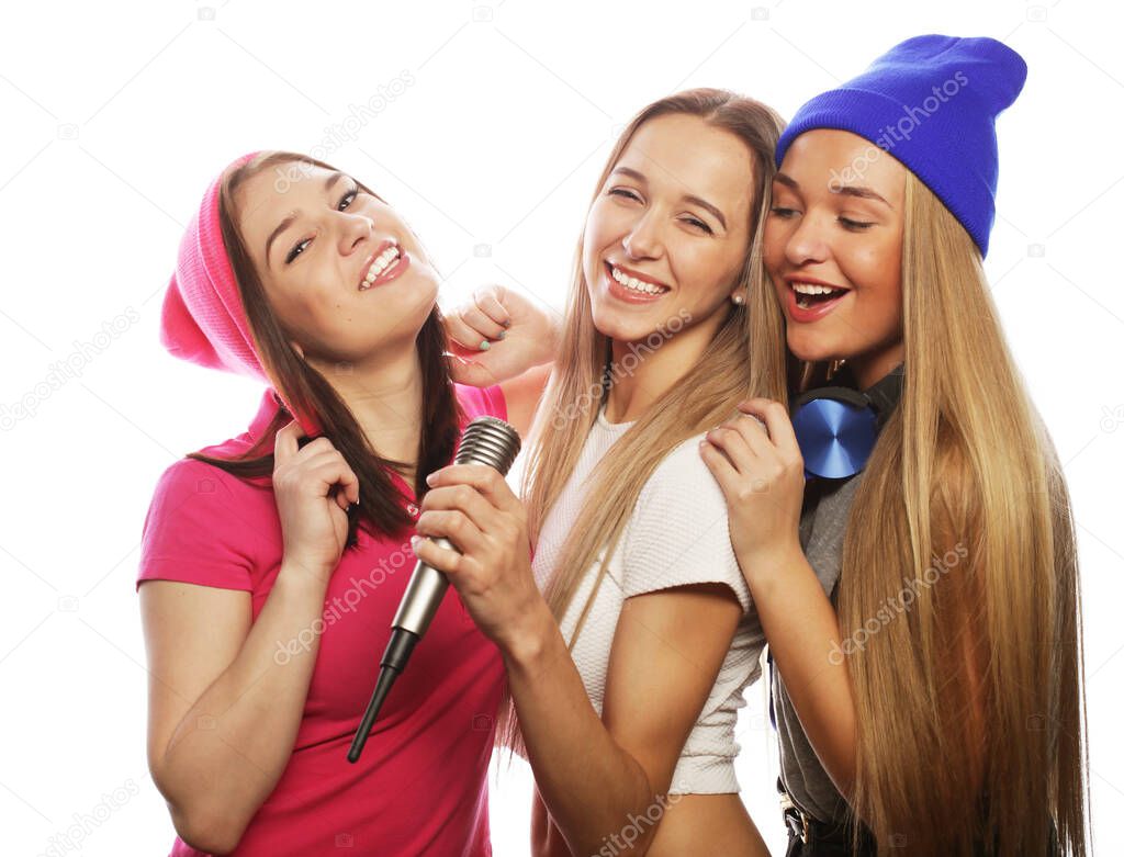 beautiful stylish hipster girls singing karaoke