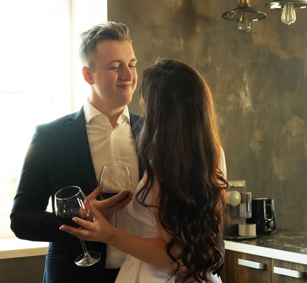 Newlyweds in love hug, kiss and drink wine — Stock Photo, Image