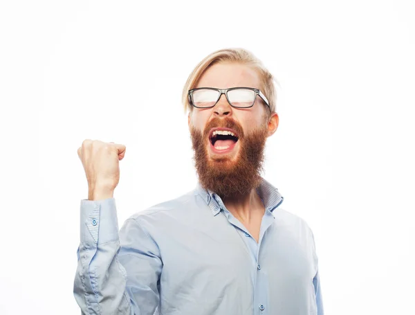 Joven hombre barbudo guapo con gafas haciendo gestos y manteniendo la boca abierta — Foto de Stock