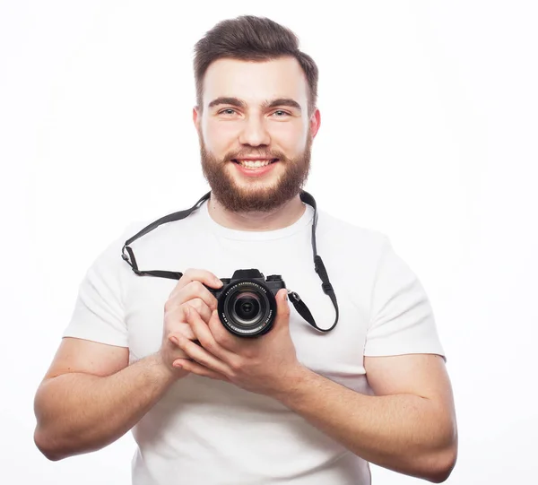Travel, technology and life style concept: young bearded photographer taking pictures with digital camera. — Stock Photo, Image