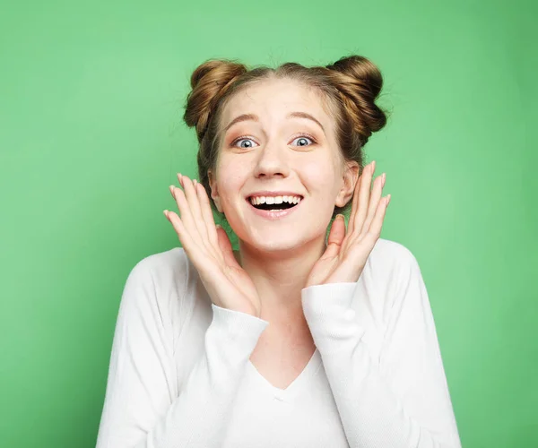 Beautiful young woman surprised and shocked looks on you. — Stock Photo, Image