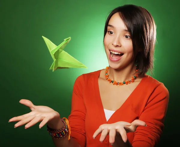 Young expression woman with paper bird — Stock Photo, Image