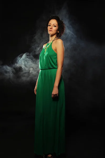 Beautiful woman in green dress — Stock Photo, Image