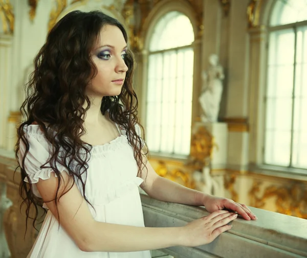 Beautiful young victorian lady in white dress — Stock Photo, Image