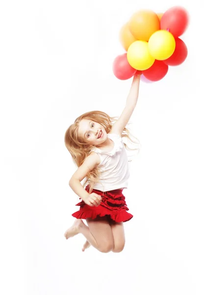 Mädchen springen mit Luftballons — Stockfoto