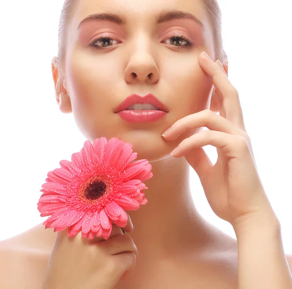 Mujer con flor de gerber rosa —  Fotos de Stock