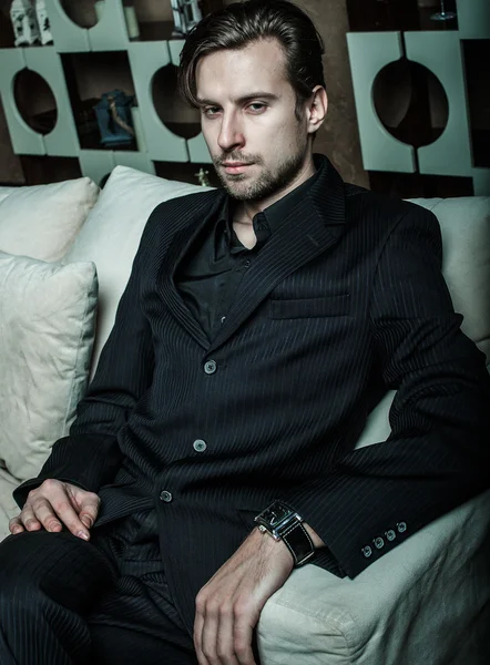 Businessman sitting on an armchair — Stock Photo, Image